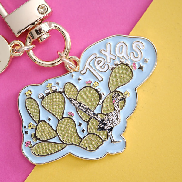 611fc05e3c4ce80992caae23_prickly-pear-and-road-runner-texas-keychain-2_1790817174159.jpg