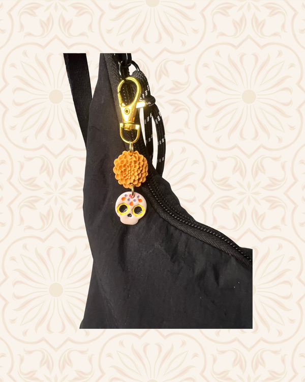611fc05e3c4ce80992caae23_sugar-skull-bag-charm-on-bag_1790634580515.png