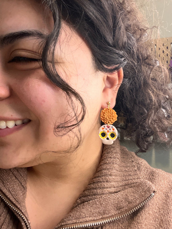 611fc05e3c4ce80992caae23_sugar-skull-marigold-earrings-modeled_1790624429636.jpg